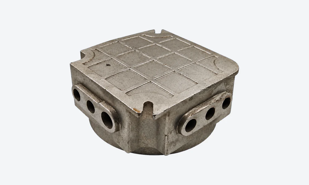 Underside of the housing showing the closed base, shallow grid pattern and open slots at the corners.