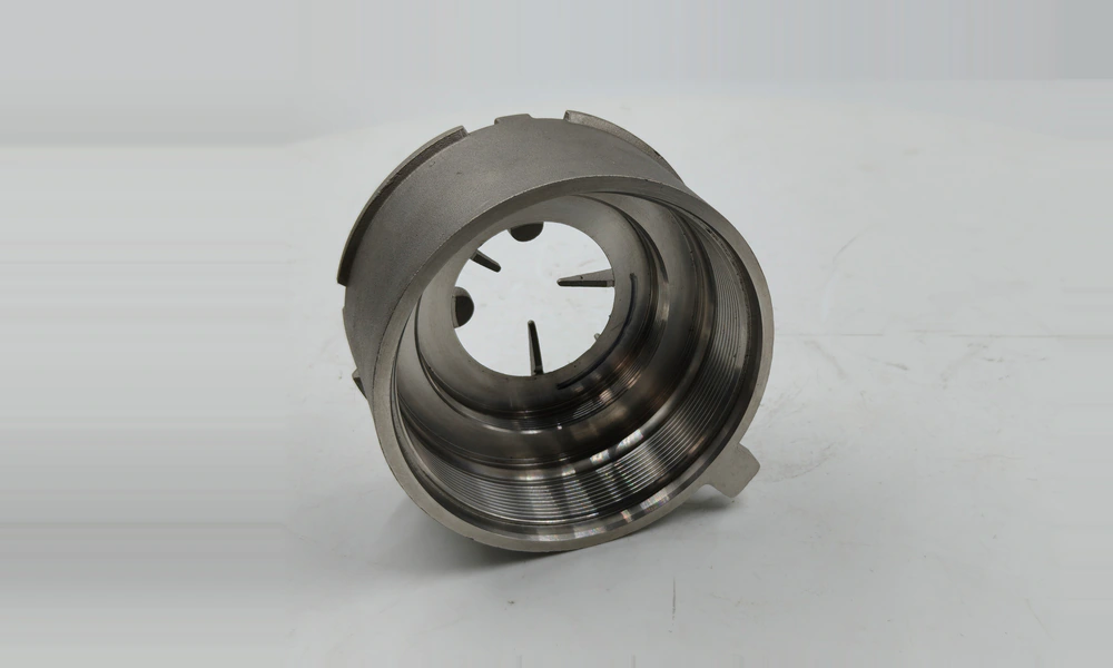 CF8M housing showing its cylindrical body and machined stepped interior with two internal threaded sections.
