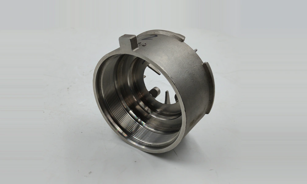 Angled view of the housing interior showing two threaded diameters and machined shoulders.