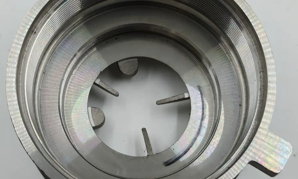Close view of the larger entrance thread, smaller recessed thread and machined shoulders inside the CF8M housing.