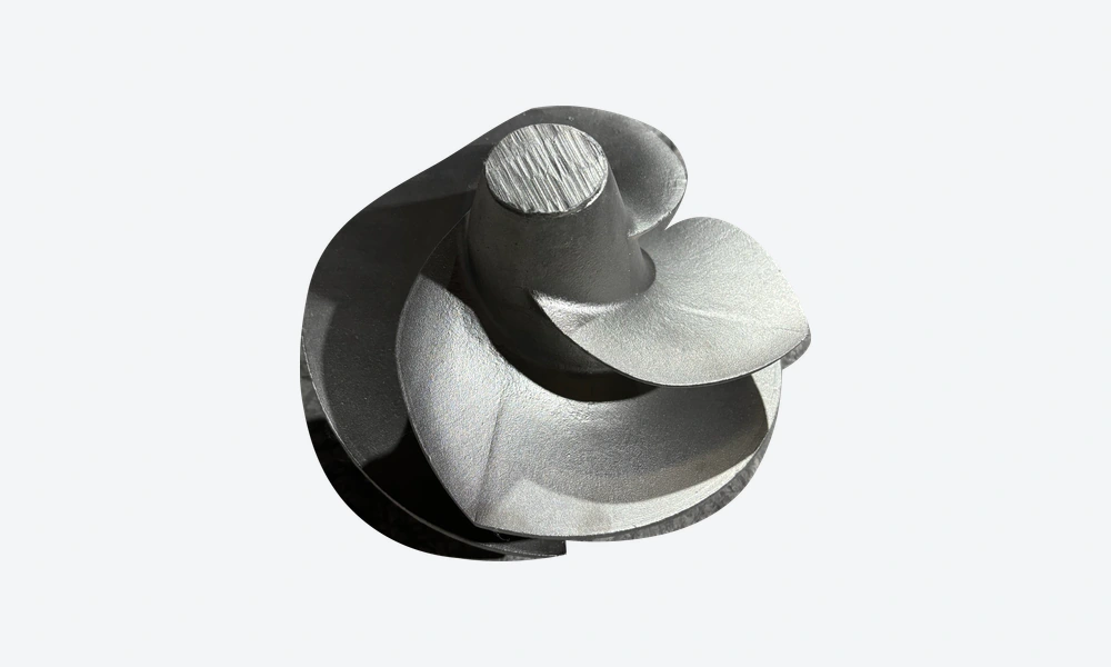 Stainless steel impeller casting blank with curved vanes extending around a central hub.